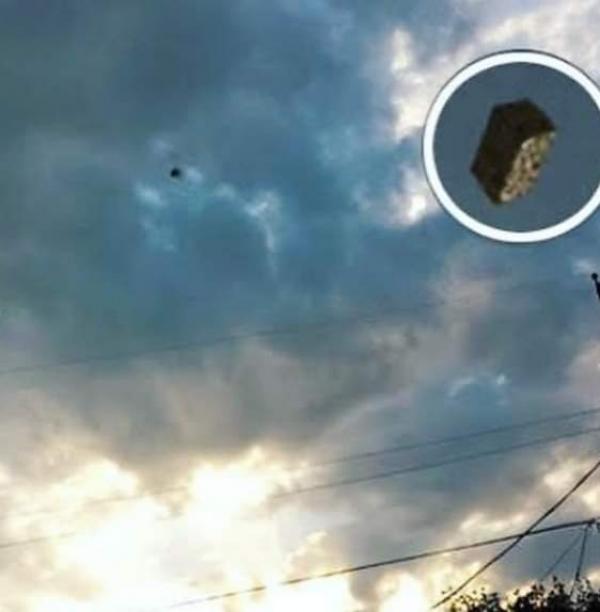 A Black Cube UFO Hurtles Out Of A Portal Over El Paso